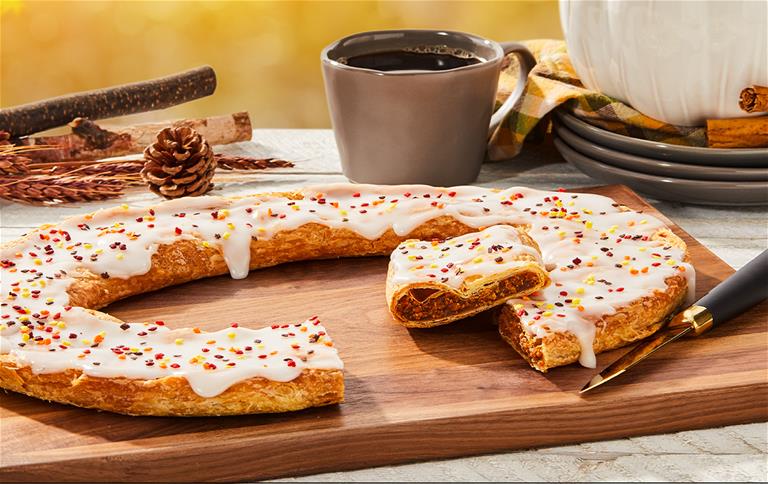 Autumn Kringle surrounded by fall items. 
