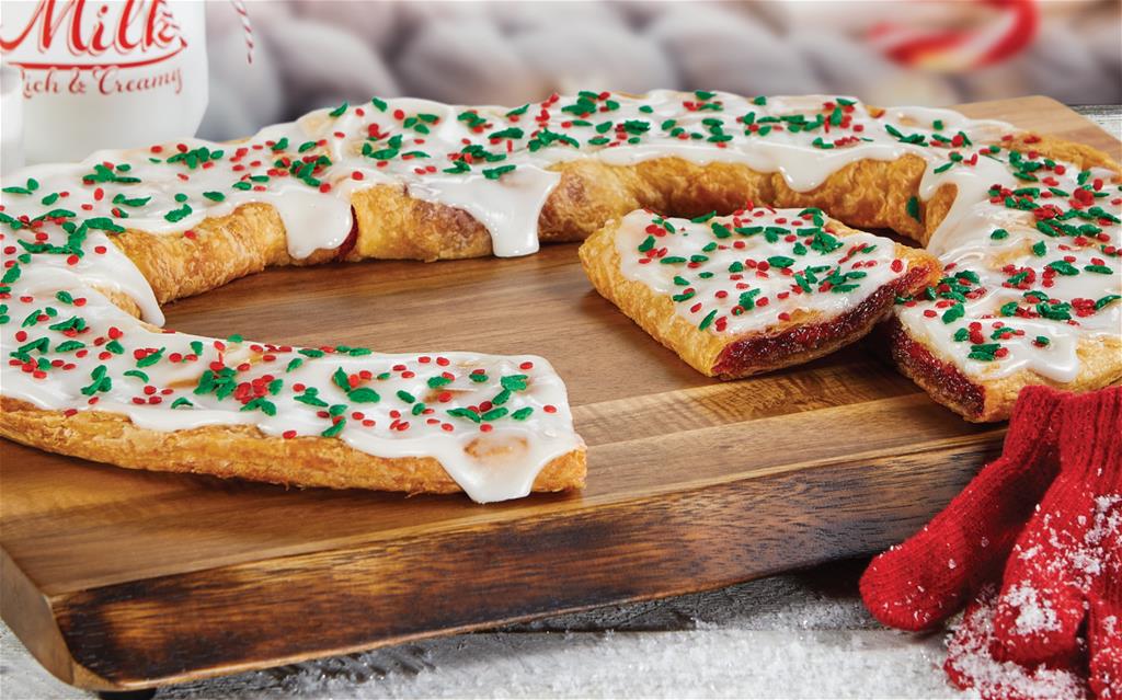 Santa Cinnaberry Kringle surrounded by winter items. 