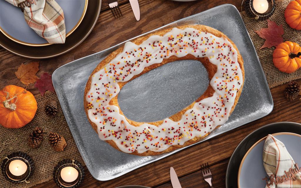 Autumn Kringle on silver tray surrounded by fall items. 