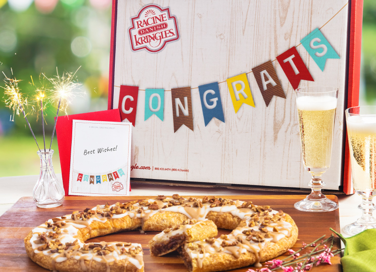 Celebration Gift Box with Kringle on platter and champagne glasses. 