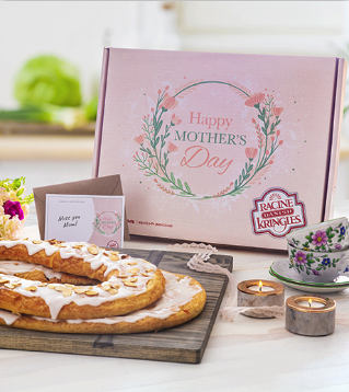 Pink box with Happy Mother's Day type with two Kringle in front, flowered saucers and light candles. 