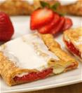Strawberry Cheesecake Kringle on a white plate with slices strawberries. 