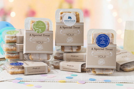 Single-serve sized Kringle in packaging with tan sleeve and circle label. 