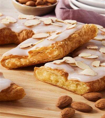 The original Kringle from way back when! Our Almond Kringle continues to be one of our best-selling Kringle year after year. Featuring a buttery-rich pastry dough, it is generously filled with almond paste. Topped with smooth vanilla icing and toasted sliced almonds, this Kringle offers a delightful nutty crunch.