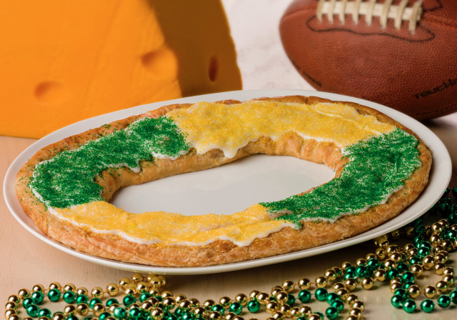 Green & Gold Kringle on white plate with cheesehead and football. 